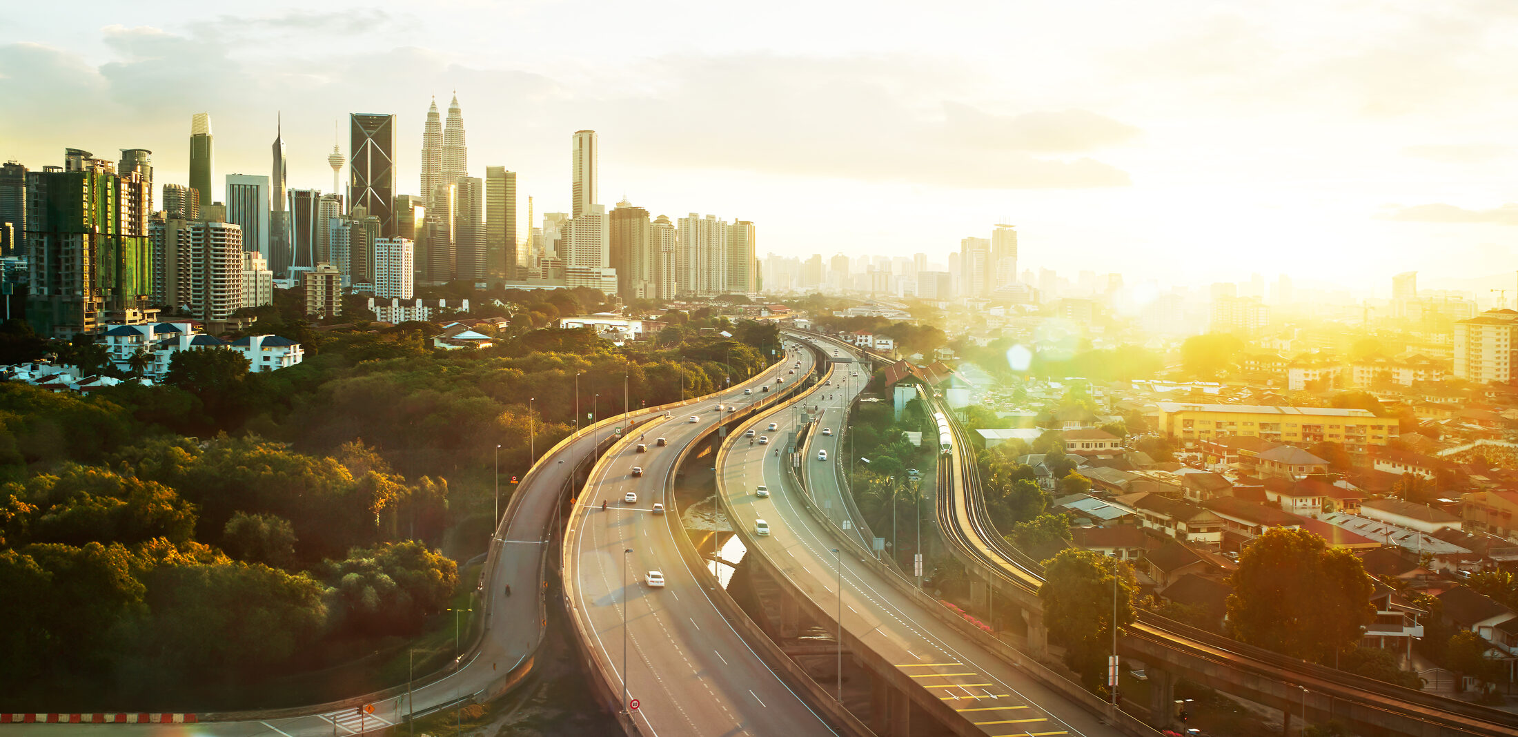 Kuala Lumpur city skyline at golden hour with the Petronas Twin Towers